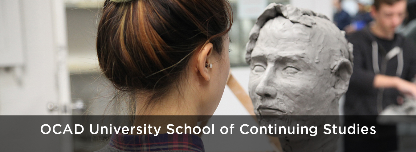 Photo of student sculpting a clay head