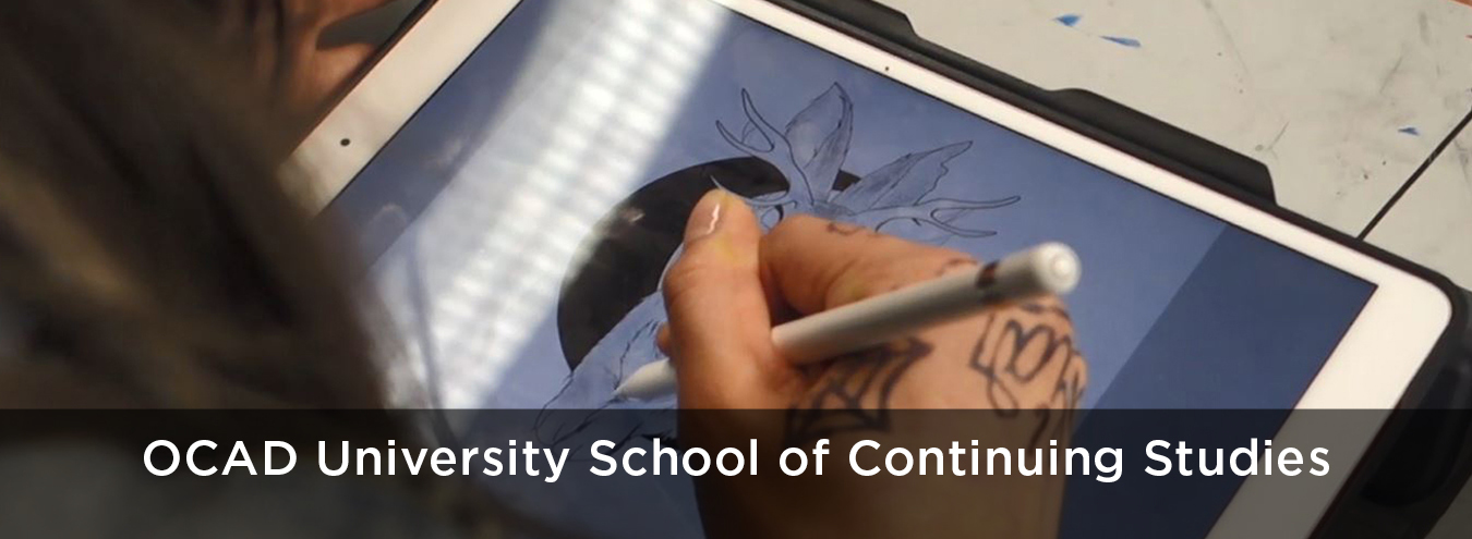 Photo of a student illustrating on a tablet